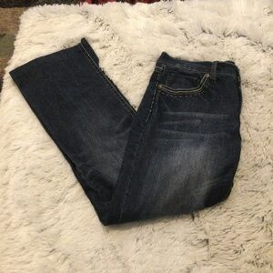 TJC Woman’s size 12 jeans dark wash 5 pocket button zipper closure